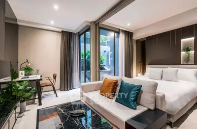 Luxurious modern bedroom with stylish decor and garden view, perfect for urban living.