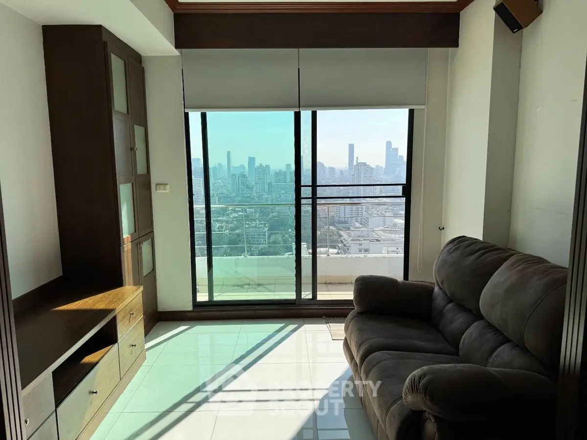 Spacious living room with stunning city view and cozy seating area
