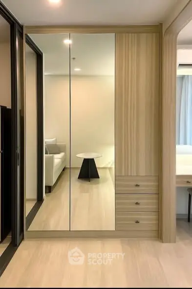 Modern bedroom with mirrored wardrobe and elegant decor