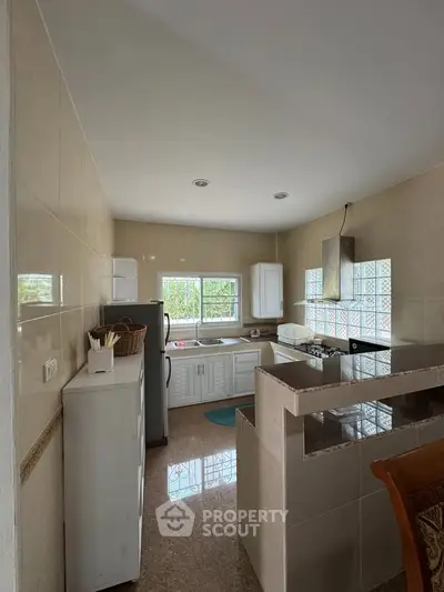 Charming kitchen with open layout and modern appliances in cozy home