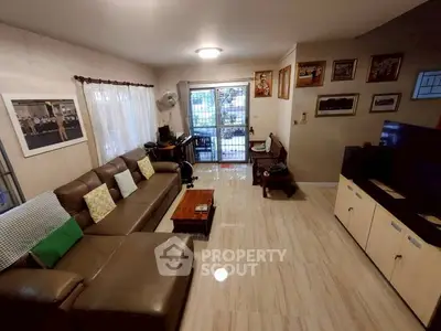 Spacious living room with modern decor and natural light