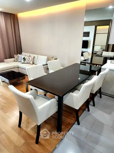 Elegant modern living room with dining area and stylish furniture