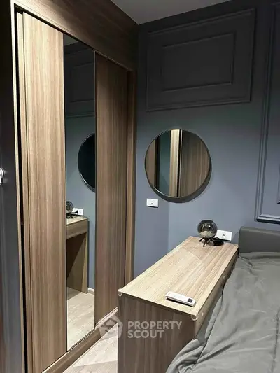 Modern bedroom with sleek wooden wardrobe and stylish decor