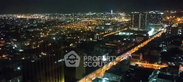 Stunning cityscape night view with illuminated skyline and vibrant urban lights.