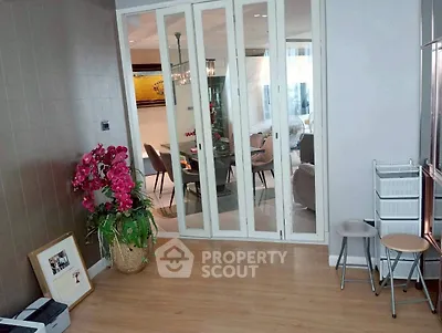 Spacious living area with sliding glass doors and elegant decor