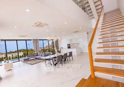 Luxurious open-plan living room with modern staircase and panoramic windows