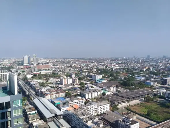 Stunning panoramic cityscape view from a high-rise building, showcasing urban skyline and vast horizon.