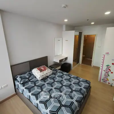 Modern bedroom with stylish decor and ensuite bathroom in a contemporary apartment.