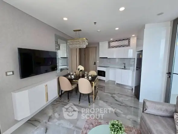 Modern open-plan living room with sleek kitchen and elegant dining area