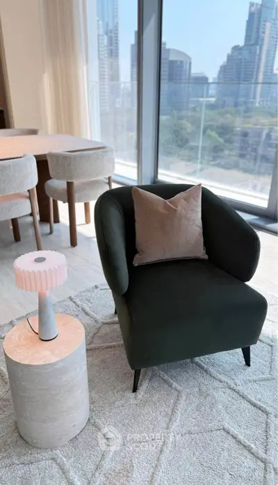 Modern living room with stylish armchair and city view