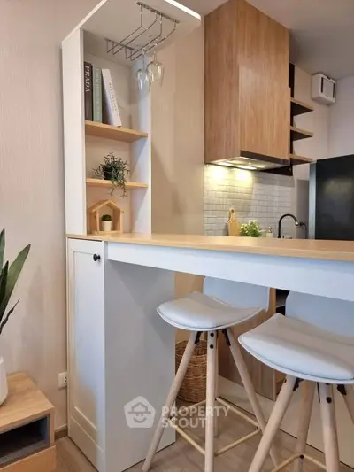 Modern kitchen with stylish breakfast bar and wooden accents