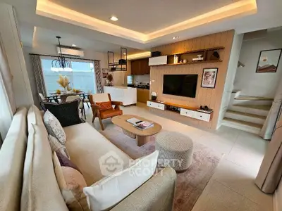 Stylish modern living room with open kitchen and elegant decor