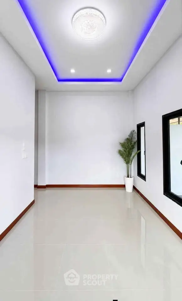 Modern minimalist interior with LED ceiling lights and sleek tile flooring