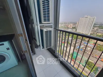 High-rise apartment balcony with city view and washing machine