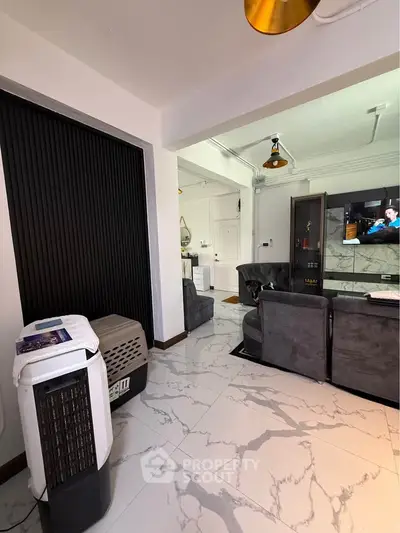 Modern living room with stylish decor and marble flooring