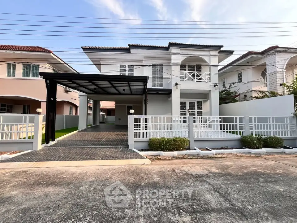 Stunning modern house with spacious driveway and elegant facade in a serene neighborhood.