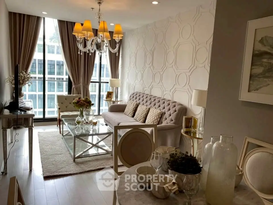Elegant living room with modern decor and large windows in a luxury apartment.