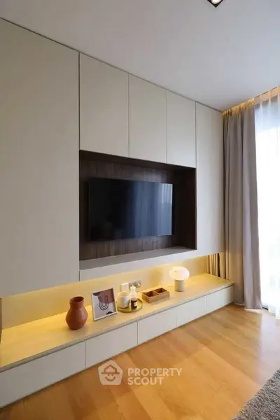 Modern living room with built-in TV unit and elegant decor
