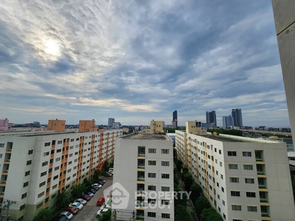 Stunning cityscape view from high-rise apartment with expansive skyline and modern architecture.