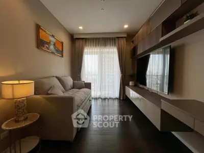 Elegant living room with modern decor and large window view