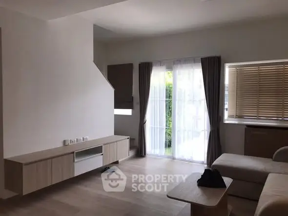 Spacious modern living room with natural light and minimalist design