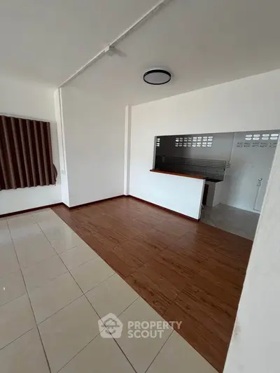 Spacious living room with open layout and modern kitchen design