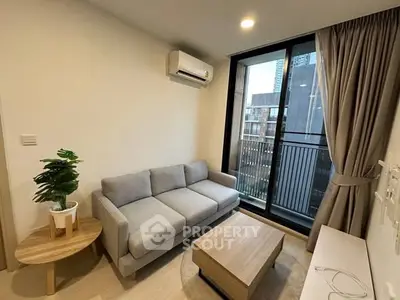 Modern living room with cozy sofa and city view balcony