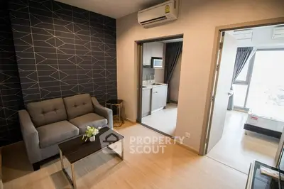 Modern apartment interior with stylish living room and compact kitchen