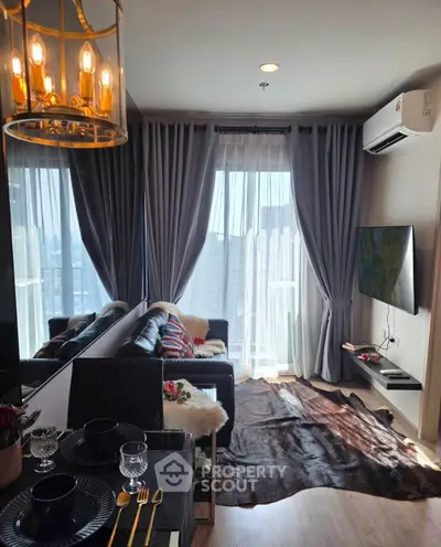 Stylish modern living room with elegant decor and city view, featuring cozy seating and chic lighting.