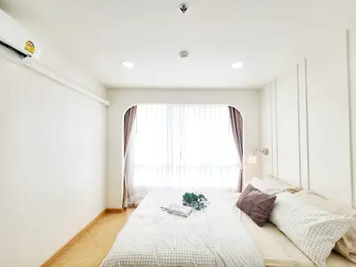 Bright and cozy bedroom with elegant decor and natural light