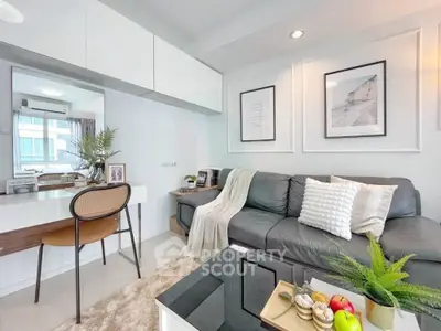 Stylish modern living room with cozy sofa, elegant decor, and natural light, perfect for relaxation and entertaining.