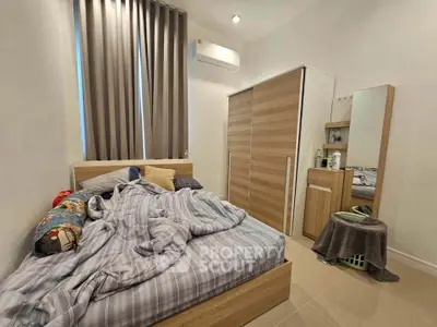 Cozy bedroom with modern furniture and natural light