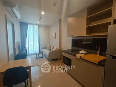 Modern compact living room with open kitchen layout and cozy decor