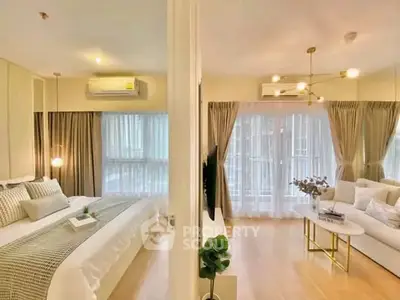 Luxurious modern apartment with elegant bedroom and spacious living room, featuring stylish decor and ample natural light.