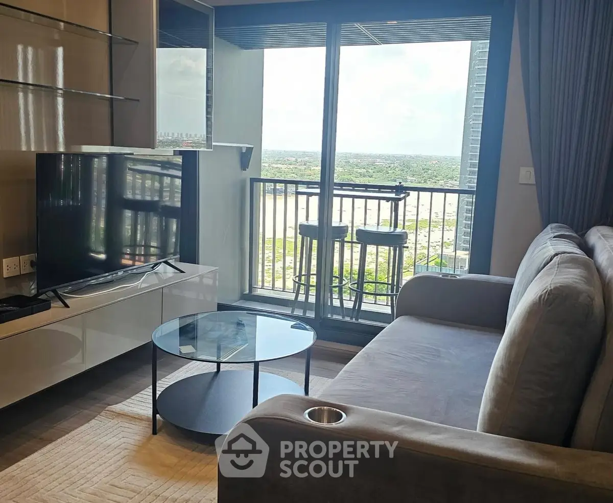 Modern living room with sleek furniture and stunning balcony view