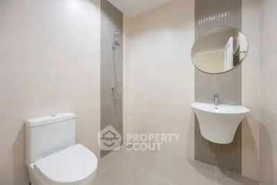 Modern minimalist bathroom with sleek fixtures and neutral tiles
