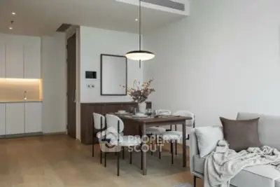 Modern dining area with elegant decor and open kitchen layout in a stylish apartment.