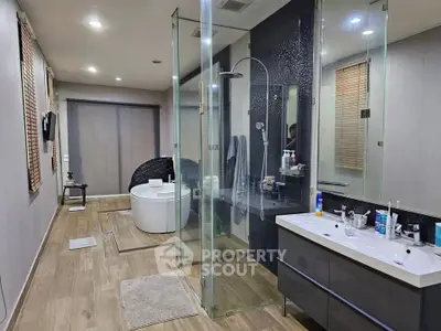 Luxurious modern bathroom with glass shower and freestanding tub