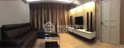 Modern living room with sleek furniture and entertainment setup