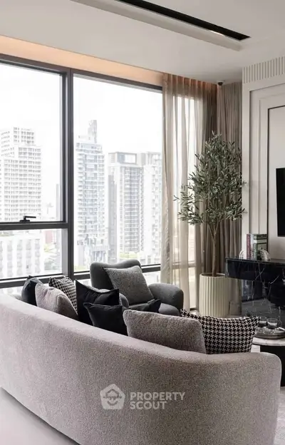 Luxurious living room with panoramic city views and elegant modern decor.