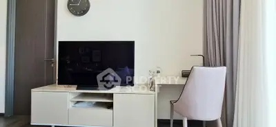 Modern living room with sleek TV stand and stylish desk setup