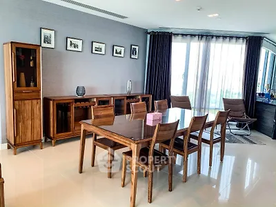 Elegant dining room with wooden furniture and large windows in modern apartment