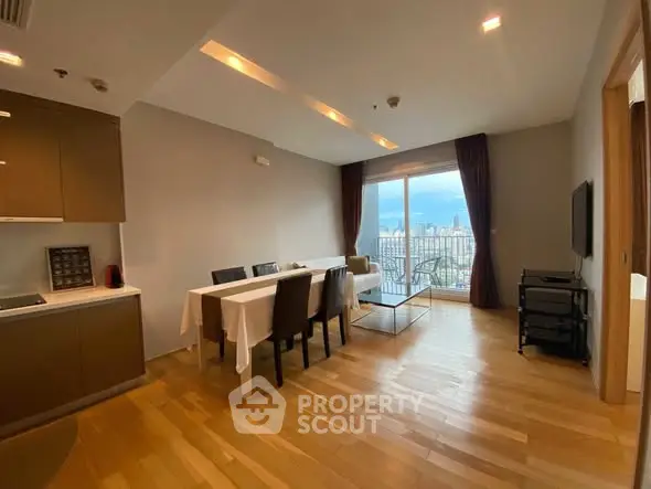 Spacious dining area with city view, modern furnishings, and natural light.