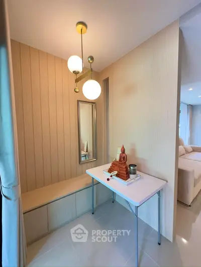 Stylish modern living room corner with elegant decor and ambient lighting.