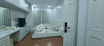 Cozy bedroom with modern furnishings and ample storage space