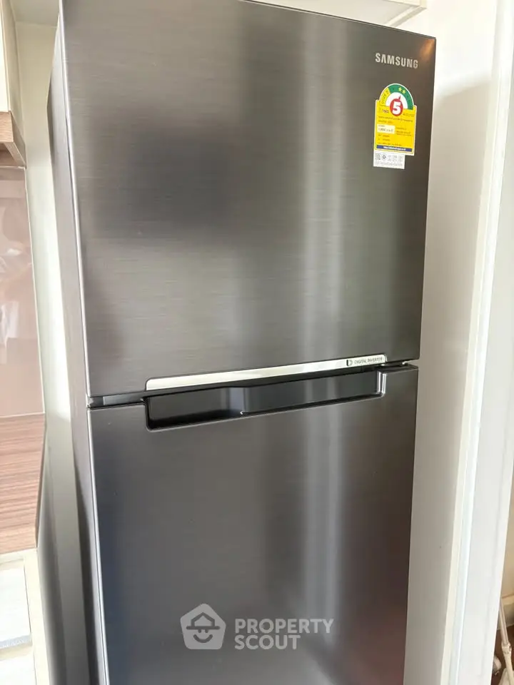 Modern stainless steel refrigerator in a sleek kitchen setting, perfect for contemporary homes.