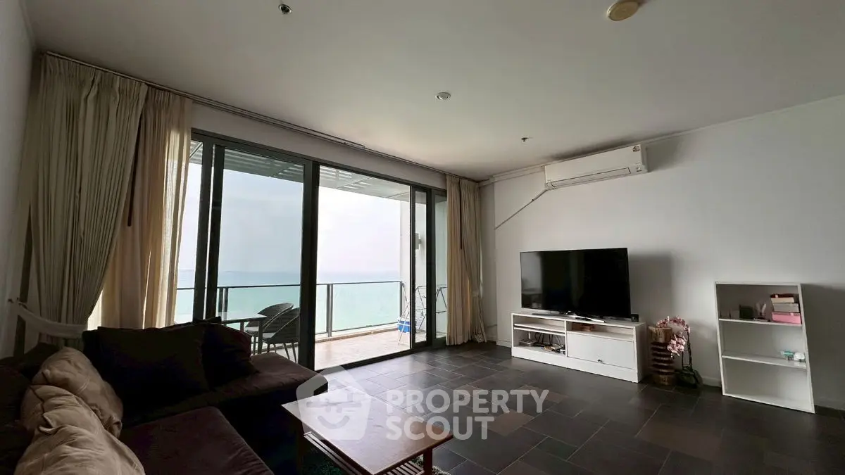 Spacious living room with ocean view and modern furnishings