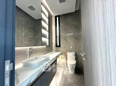 Luxurious modern bathroom with sleek fixtures and elegant lighting