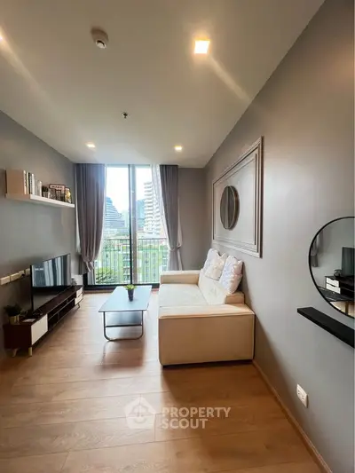 Modern living room with large window and stylish decor in urban apartment