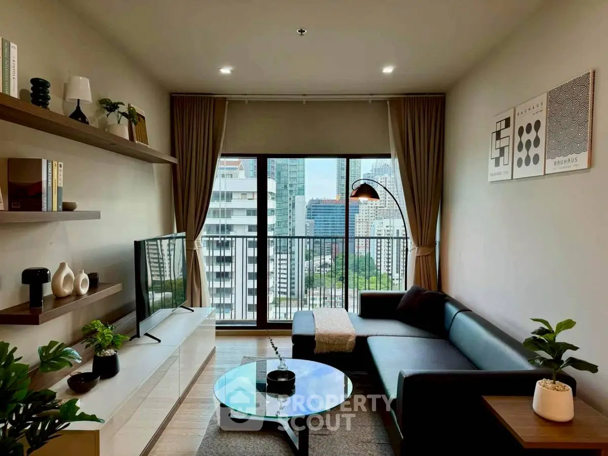 Modern living room with city view, stylish decor, and cozy seating area.